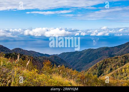 Sado Island: Autumn foliage scenery of the Osado Mountains and the Sea of Japan seen from the highest point of the Osado Skyline Stock Photo