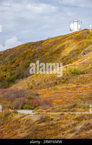 Autumn foliage scenery of the Myoko Mountains seen from the highest point of the Sado Island Sado Skyline and ATC radar of the Air Self-Defense Force Stock Photo