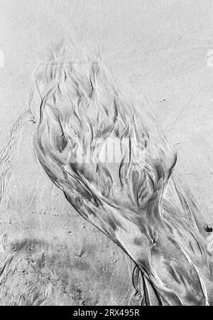 islamische Muster Art Textur am Sandstrand bei Ebbe-Zeit Stockfoto