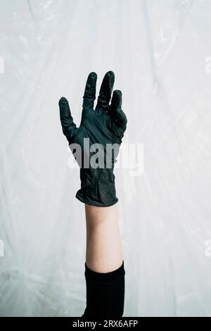 Handschuh aus schwarzem Kunststoff Stockfoto
