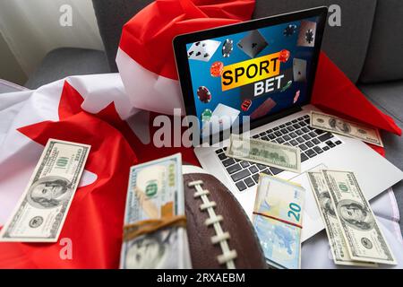 Laptop mit Sportwetten und kanadischer Flagge Stockfoto