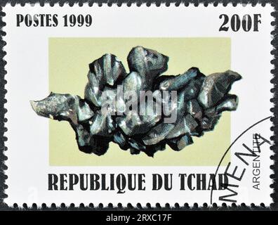 Gestempelte Briefmarke, gedruckt von Tschad, auf der Argentite zu sehen ist, um 1999. Stockfoto