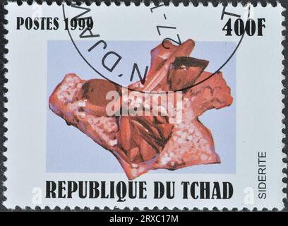 Gestempelte Briefmarke, gedruckt von Tschad, die Siderite zeigt, um 1999. Stockfoto