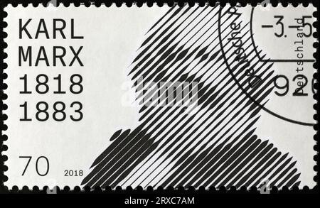 Stilisiertes Porträt von Karl Marx auf deutscher Briefmarke Stockfoto