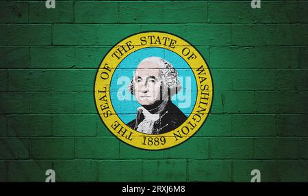 Die Flagge des Washingtons ist auf einer Mauer aus Ackerstein gemalt. Stockfoto