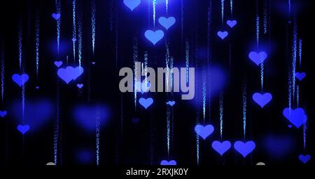 Festlicher blauer Liebeshintergrund mit Herzen, die zum Valentinstag mit Unschärfe und Glühen-Effekt und Partikeln herunterfliegen. Abstrakter Hintergrund. Stockfoto