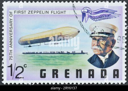 Annullierte Briefmarke gedruckt von Grenada, die den 75. Jahrestag des ersten Zeppelin-Fluges um 1977 feiert. Stockfoto