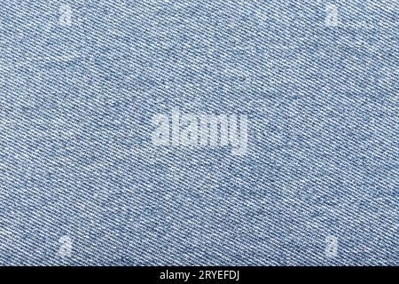 Hintergrund aus hellblauem Denim-Material Stockfoto