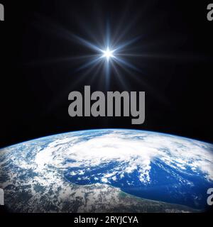 Heller Stern scheint über der Erde im Weltraum. Geburt des Jesus-Konzeptes, Stern von Bethlehem. Elemente dieses Bildes, die von der NASA bereitgestellt wurden Stockfoto