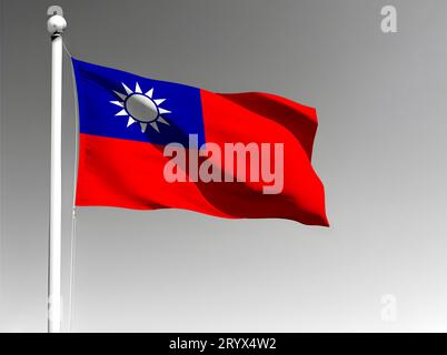 Taiwans Nationalflagge isoliert winkend auf grauem Hintergrund Stockfoto