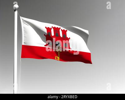 Gibraltars Nationalflagge, isoliert, winkend auf grauem Hintergrund Stockfoto