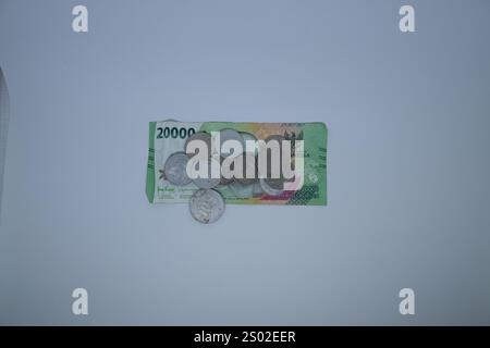 EID-Banknoten und -Münzen aus der Währung der Republik Indonesien Stockfoto