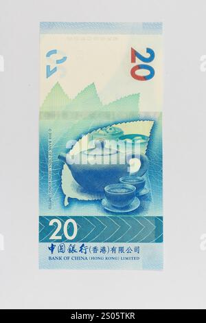 Hongkong 20 Dollar Bank of China vertikale Währungsnote mit Teekanne mit Becher. Hervorhebung des Themas der Teekultur. Stockfoto