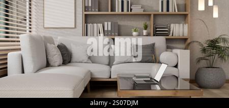 Eine Nahansicht eines Laptops auf einem Couchtisch in einem gemütlichen, modernen Wohnzimmer mit großem grauen Sofa, Bücherregal und elegantem Dekor. 3D Stockfoto