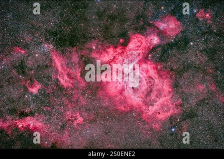 Der Carina-Nebel und die umgebenden Flecken der Emissionsnebulosität. Stockfoto