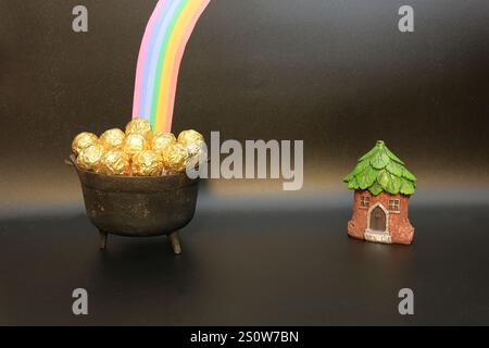 Leprechaun's Pot of Gold auf Einem einfachen schwarzen Hintergrund für St. Patrick's Day Stockfoto