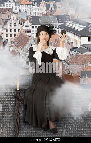 Junge Frau in der Rolle der Mary Poppins, die auf dem Dach sitzt Stockfoto