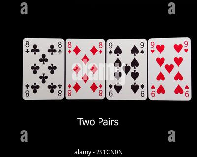 Vier Spielkarten mit den Zahlen 8, 9. Die Karten sind hintereinander angeordnet. Pokerkarten Stockfoto