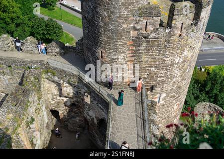 Conwy Wales - July 31 2024; Tourists exploring inside medieval Conwy Castle. Stockfoto