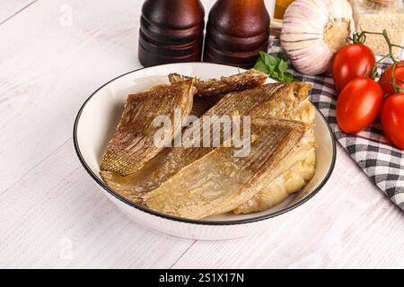 Gebackene Stachelrochen mit Öl und Gewürzen Stockfoto