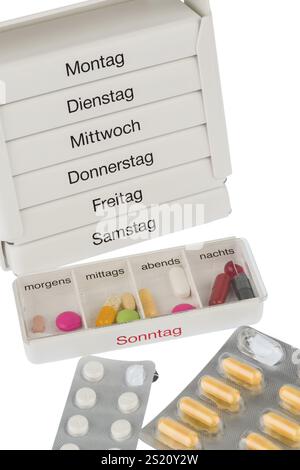 Tablettenspender und Tabletten, Symbolfoto zur Therapie, Verschreibung, Dosierung Österreich Stockfoto