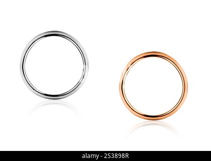 Einsame goldene und silberne Eheringe isoliert. Einsame goldene und silberne Eheringe Stockfoto