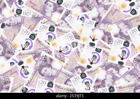 20 britische Pfund-Scheine liegen in einem großen Haufen. Konzeptioneller Hintergrund des reichen Lebens. Viel Geld. 20 britische Pfund-Scheine liegen in einem großen Haufen. Ein reiches Leben Stockfoto