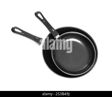 Schwarze Pfannen isoliert auf weißem Hintergrund. Schwarze Pfannen isoliert auf weiß Stockfoto