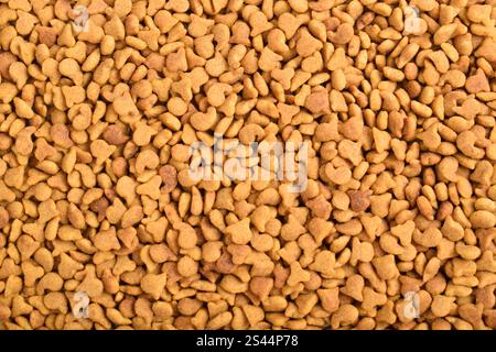 Textur von Heimtierfutter. Trockenfutter Für Katzen. Haufen von Tierfutter. Hintergrund für Trockenfutter Stockfoto