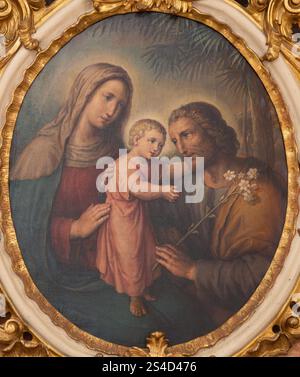 WIEN, AUSTIRA - 24. JUNI 2021: Gemälde der Heiligen Familie aus der Wiener Kirche Gertrudkirche von unbekanntem Künstler. Stockfoto