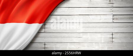 Indonesische Flagge an der alten weißen Wand. Horizontales Panorama-Banner. Indonesische Flagge auf altem weißen Wandbanner Stockfoto