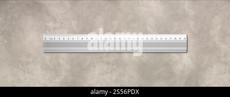 Stahllineal aus Metall isoliert auf Betonhintergrund. Metalllineal isoliert auf Betonhintergrund Stockfoto