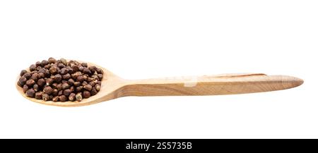 Die Körner des Paradiespfeffers im hölzernen Löffel isoliert auf weiß Hintergrunde Stockfoto