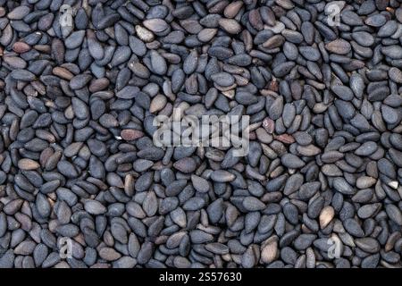 Hintergrund des Essens - viele schwarze Sesamsamen Stockfoto