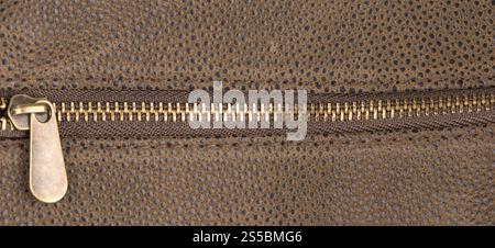 Braun Leder-Textur und Reißverschluss-Hintergrund Stockfoto