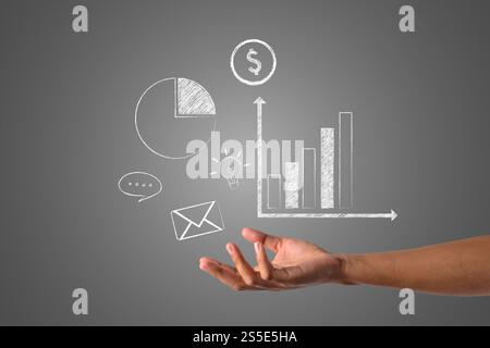 Der Graph ist mit einer weißen Kreide in der Hand geschrieben, zeichnen Konzept. Stockfoto