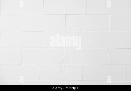 Weiße Ziegelwand. Weiße Zementmarmor-Blockstruktur. Stockfoto