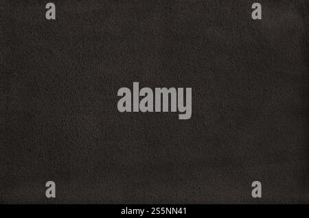 Schwarzer Wildlederhintergrund. Natürliches Materialmuster. Schwarzer Wildlederhintergrund Stockfoto