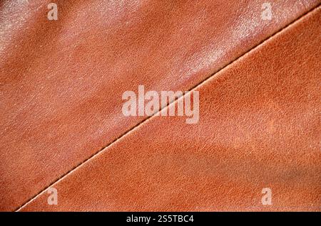 Braunes Leder Textur. Nützlich als Hintergrund für jedes Design arbeiten. Makrofotografie der Oberbekleidung aus echtem Leder Stockfoto