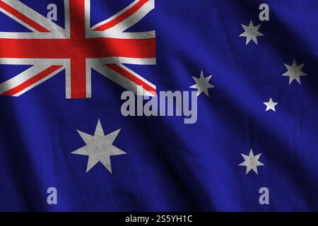 Australien-Flagge mit großen Falten, die unter dem Studio-Licht in Innenräumen aus nächster Nähe winken. Die offiziellen Symbole und Farben im Stoffbanner. Australien Flagge mit Stockfoto