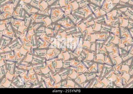 Ein Teil des braunen Guyana-1000-Dollar-Banknotenmusters aus nächster Nähe. Teil des braunen Guyana 1000-Dollar-Banknotenmusters Stockfoto