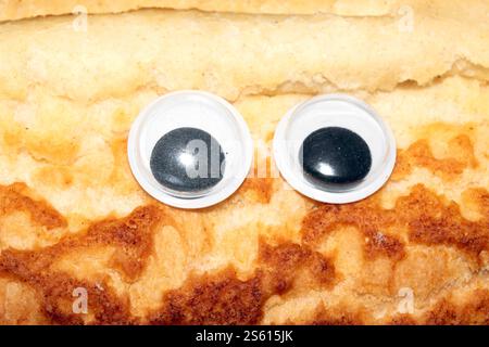Brothintergrund lustiges Wiggle Google Eyes on Fabric Dumly Stockfoto