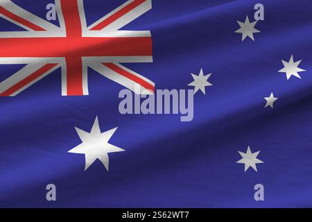 Australien-Flagge mit großen Falten, die unter dem Studio-Licht in Innenräumen aus nächster Nähe winken. Die offiziellen Symbole und Farben im Stoffbanner. Australien Flagge mit Stockfoto