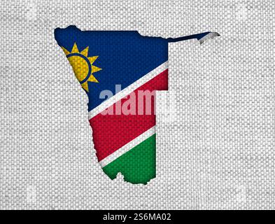 Karte und Flagge von Namibia auf alten Leinen Stockfoto