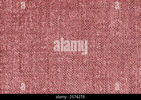 Polsterung rot gefärbter Jacquard Stoff grobe Webstruktur Nahaufnahme, Makro. Textilhintergrund, Möbel Textilmaterial, Tapete, Hintergrund. Gerinnsel Stockfoto
