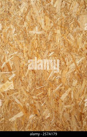 Nahaufnahme des osb-Strukturmusters (Oriented Strang Board) für die Verwendung in der Konstruktion. Stockfoto