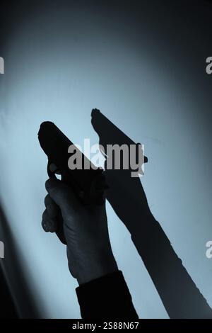 Pistolenpistole künstlerische Fotografie Bucheinband Design. Stockfoto