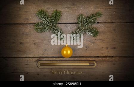 Geweih Hirsch oder rehbock aus Tannenzweig mit Nase aus Weihnachtskugel mit Ladebalken. Frohe Weihnachten und ein frohes neues Jahr 2025. Stockfoto