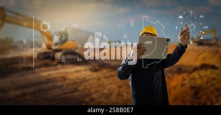 Intelligentes Bauprojekt Ein Bauarbeiter verwendet Ein Tablet, um ein 3D-Modell einer Baustelle anzuzeigen. Unternehmen Stockfoto