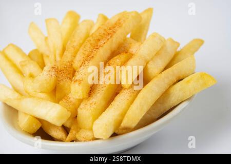 Pommes frites mit Paprika Stockfoto